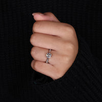 round cut side stone on tapered pave engagement ring.
