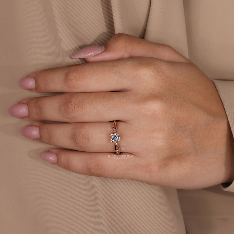 IGI certified round diamond ring with rose gold twisted band.
