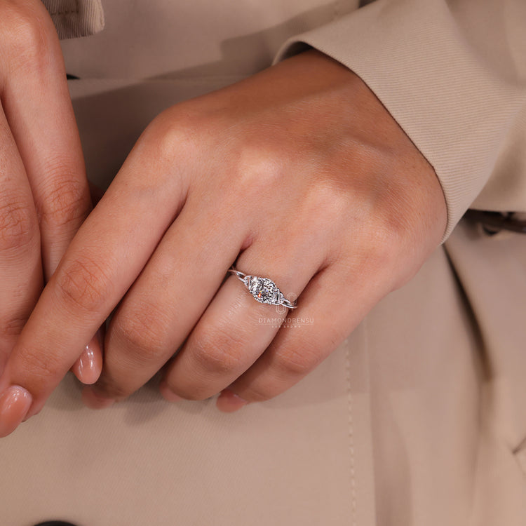 Twist shank ring featuring solitaire Portuguese cut lab grown diamond in white gold.
