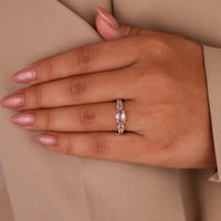 Round rose cut side stone ring with prong setting in rose gold.
