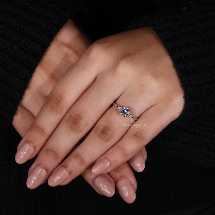White gold engagement ring paired with Round Diamond Engagement Ring.

