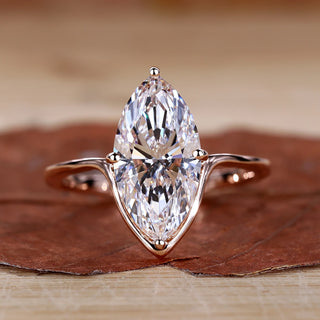 Marquise Diamond Engagement Ring with compass prong setting in rose gold.
