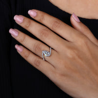 Round cut pave setting in pear shaped engagement ring.
