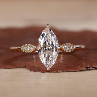 Marquise diamond engagement ring with elegant detailing.
