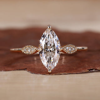 Marquise diamond engagement ring with elegant detailing.
