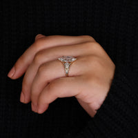 3 stone engagement ring in yellow gold band.
