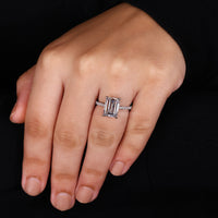 4 claw prong setting on emerald cut ring.
