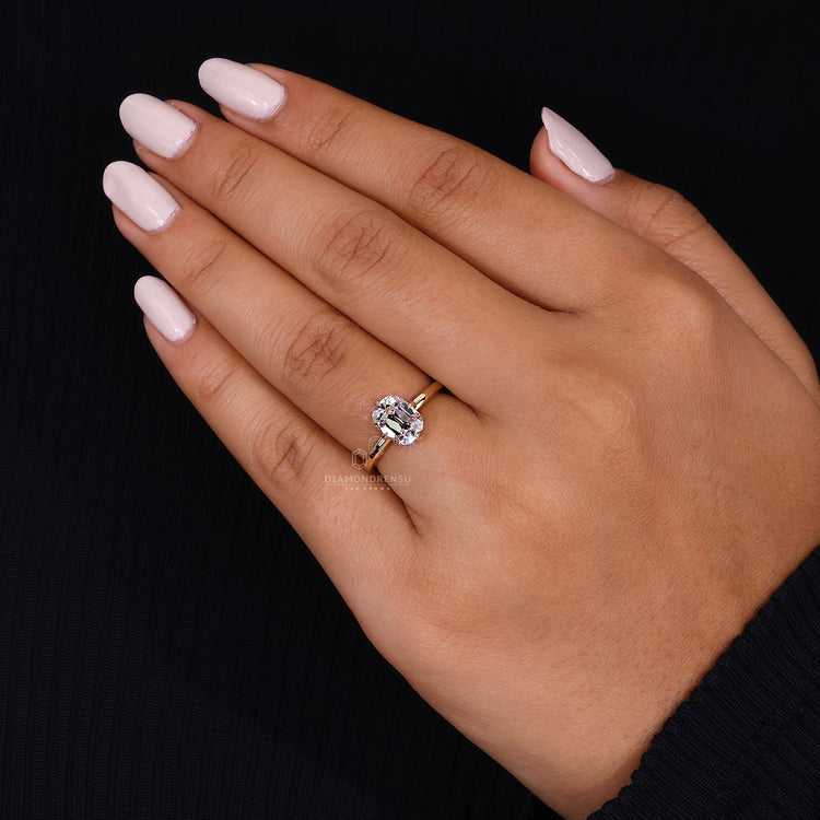 Old mine cut diamond in solitaire yellow gold setting.
