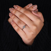 white gold engagement ring with round diamond ring detail.
