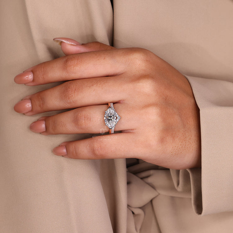 White gold ring with marquise diamond and east west setting.
