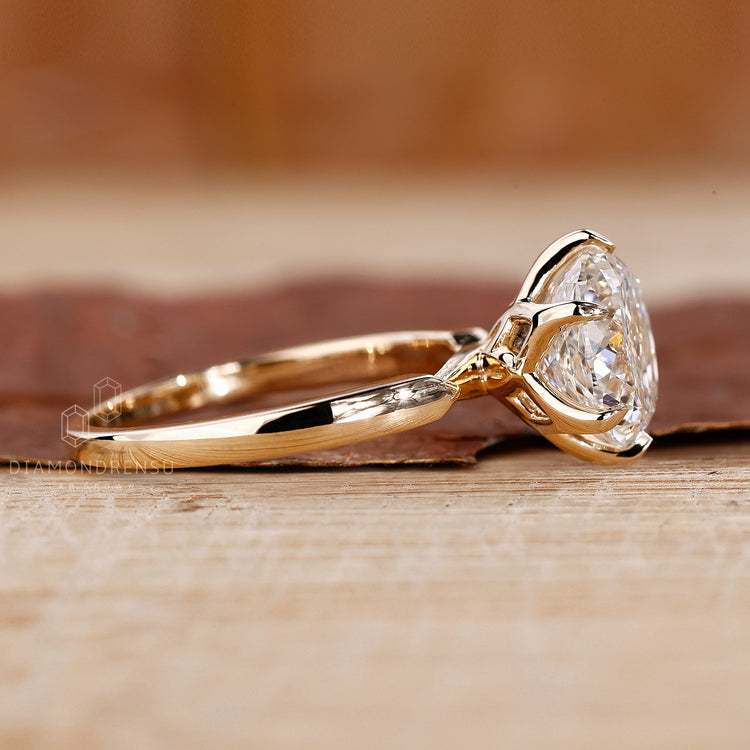 Pinched shank ring in yellow gold ring.
