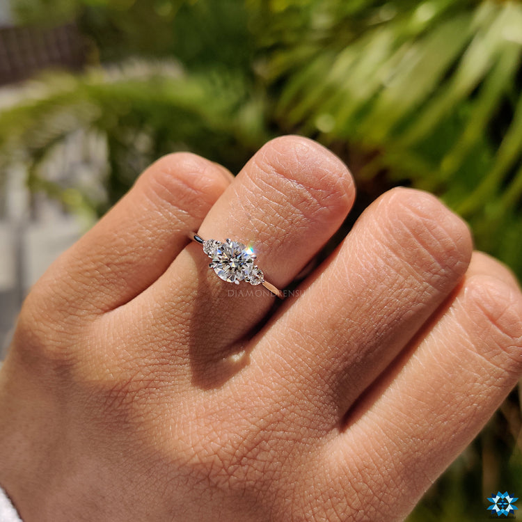 Round moissanite ring four claw prong setting.