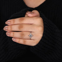 round with baguette side stones in v prong setting.

