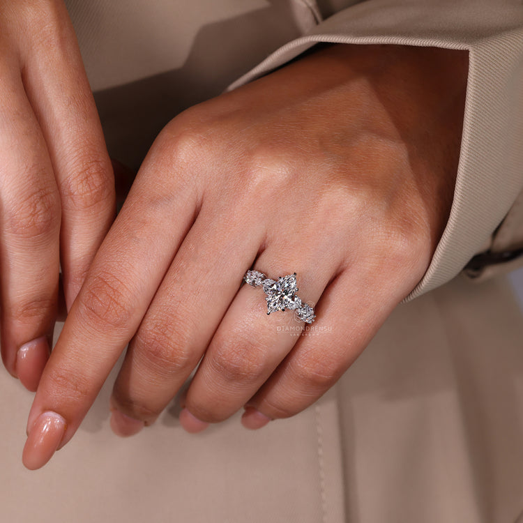 IGI certified marquise engagement ring with claw setting and pavé.
