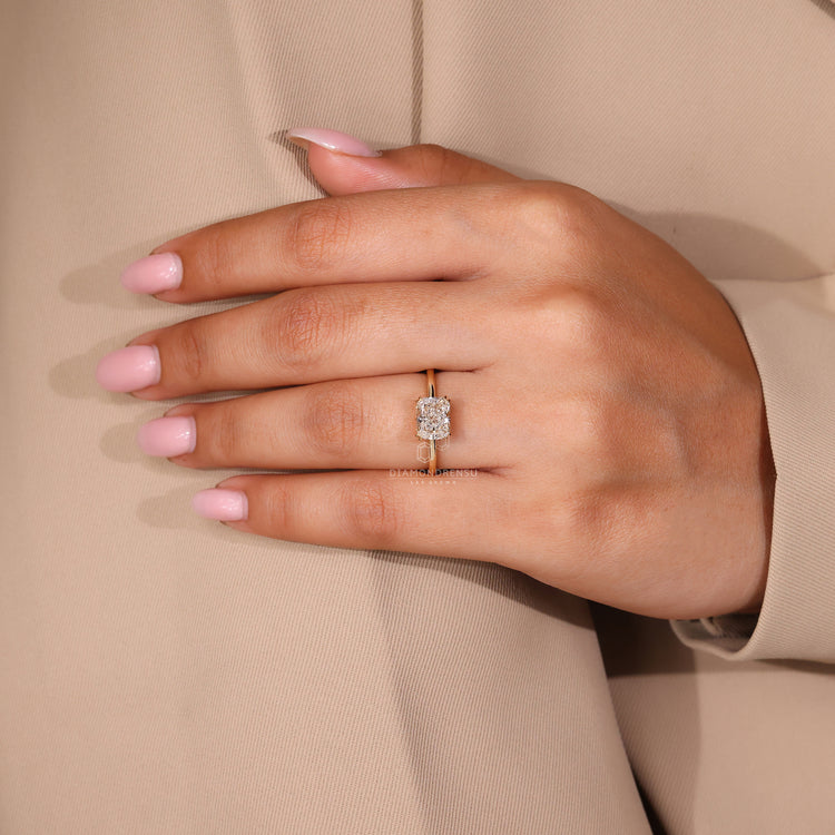 Double claw prong setting ring with cushion cut diamond in yellow gold.
