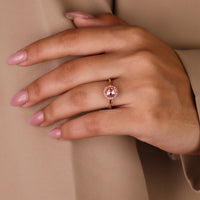 Custom diamond ring with round rose cut in halo design.
