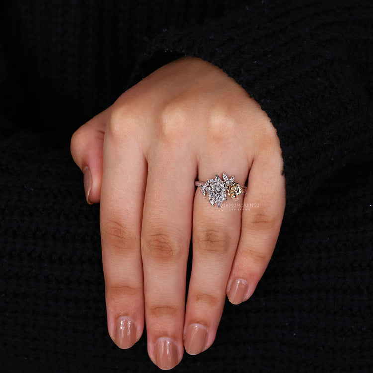 Split shank engagement ring with Dutch marquise and round side stones.
