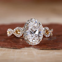 Oval cut engagement ring with prong setting in yellow gold.
