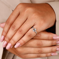 Yellow gold diamond ring featuring emerald cut engagement ring.
