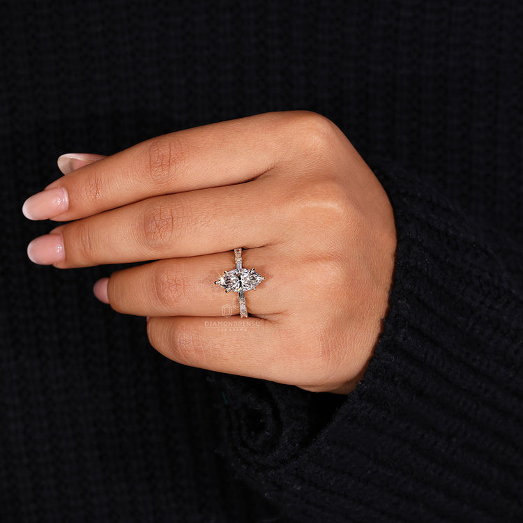 6 claw prong setting on marquise diamond engagement ring.
