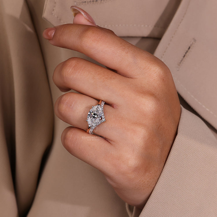 Custom diamond ring with marquise cut and unique east west setting.
