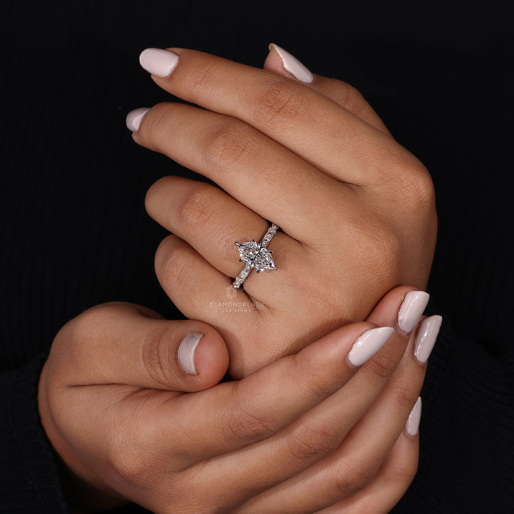 unique engagement ring featuring marquise shape outline.
