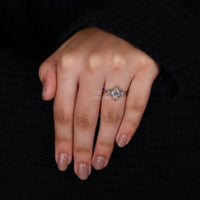white gold diamond ring with elegant 3 stone design.
