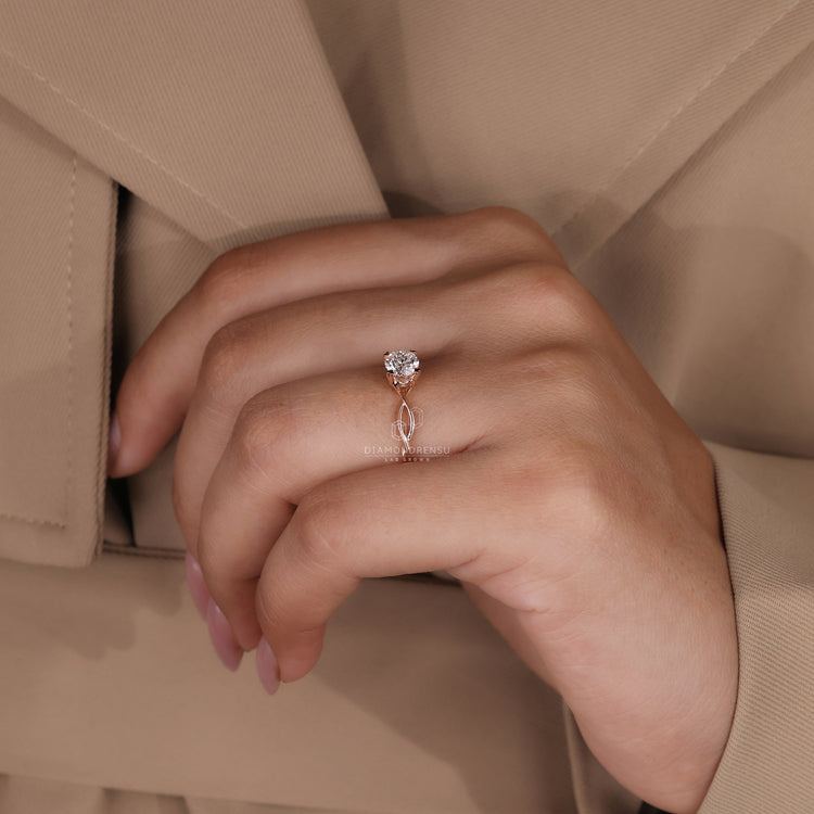 Rose gold ring with round cut lab grown diamond and solitaire setting.
