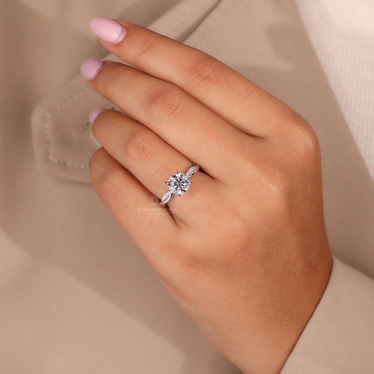 4 claw prong setting holding a brilliant round diamond in a custom design.
