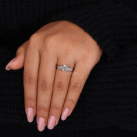 White gold ring with Portuguese cut diamond and nature inspired design.
