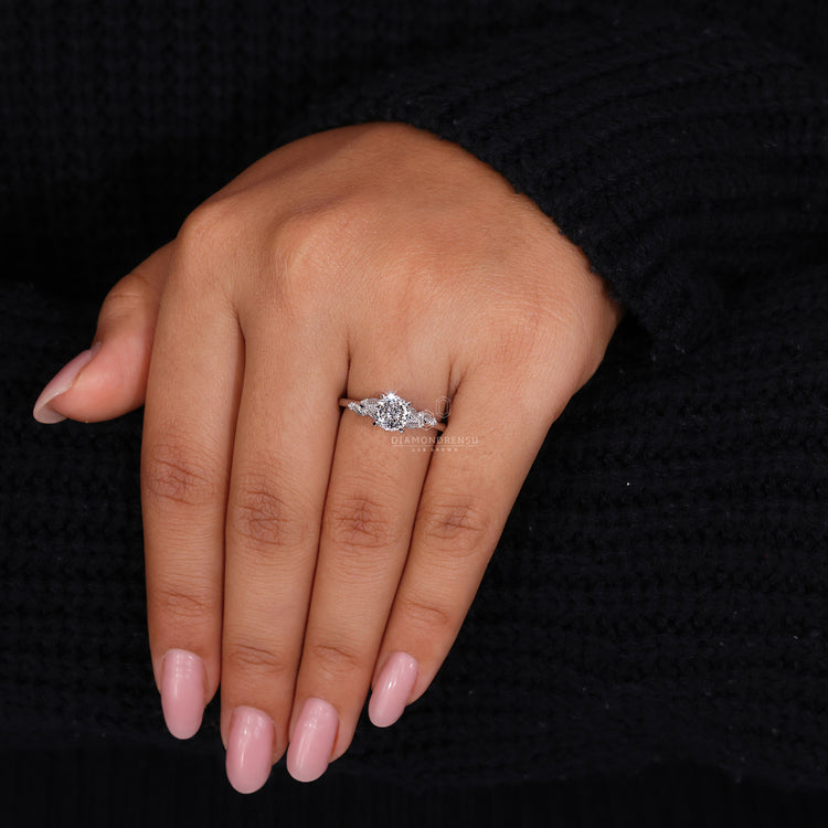 White gold ring with Portuguese cut diamond and nature inspired design.
