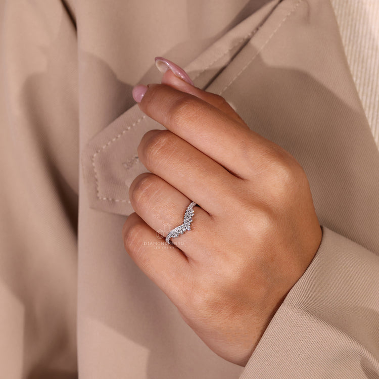 Round cut diamond band in white gold wedding band.
