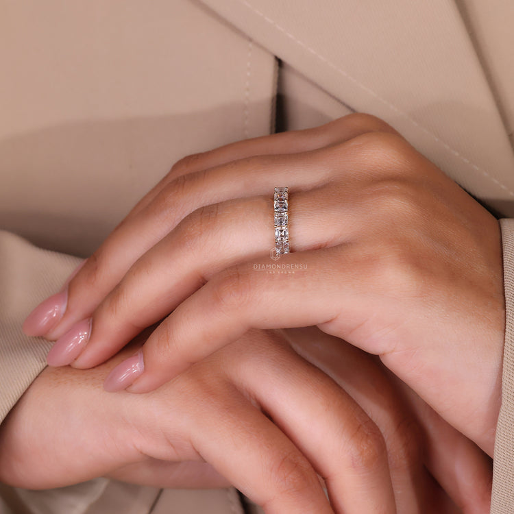 Custom diamond band with prong setting style.