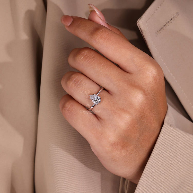 Customise ring with pear cut lab grown diamond and twisted shank design.
