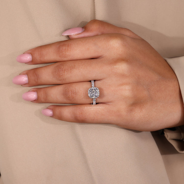 Lab grown diamond cushion cut ring with halo and yellow gold setting.
