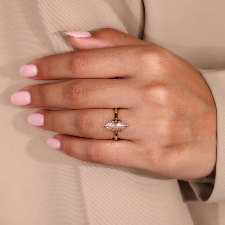 Solitaire diamond ring with Dutch marquise cut in custom design.
