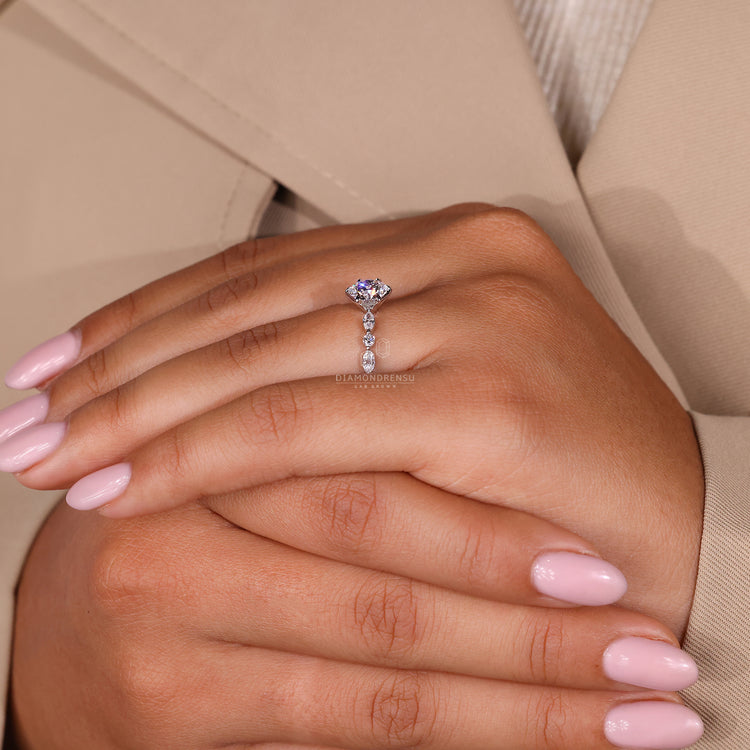But engagement ring in white gold with intricate claw prong setting.
