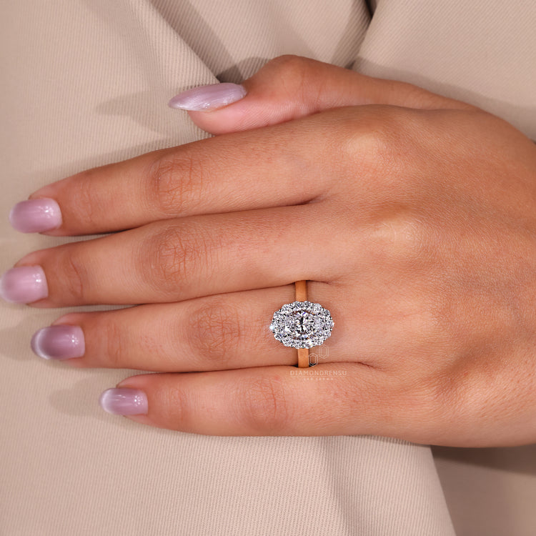 Designer oval cut engagement ring with halo.
