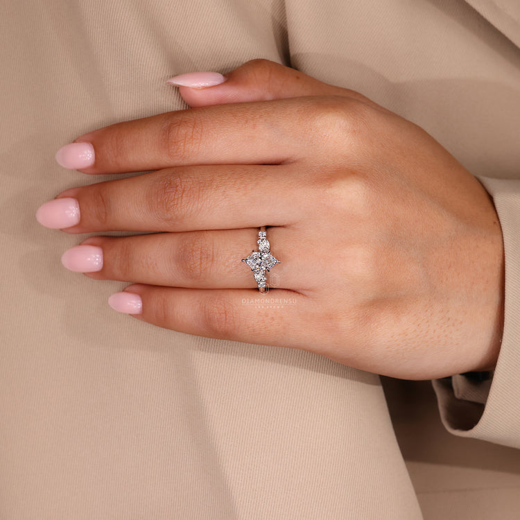 Lab grown diamond ring with round side stones and white gold band.
