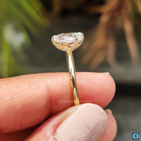 Pear shaped engagement ring adds sophistication.
