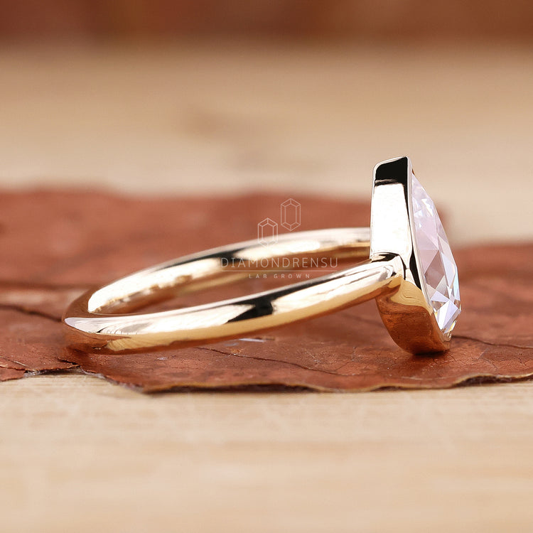 Handmade simple engagement ring with pear rose cut diamond.
