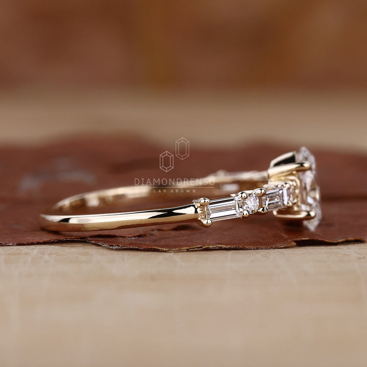 Custom yellow gold ring with oval cut diamond.
