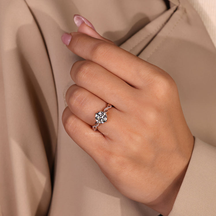 IGI certified round cut diamond ring in twisted pavé setting.
