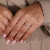 Marquise diamond wedding band for her.
