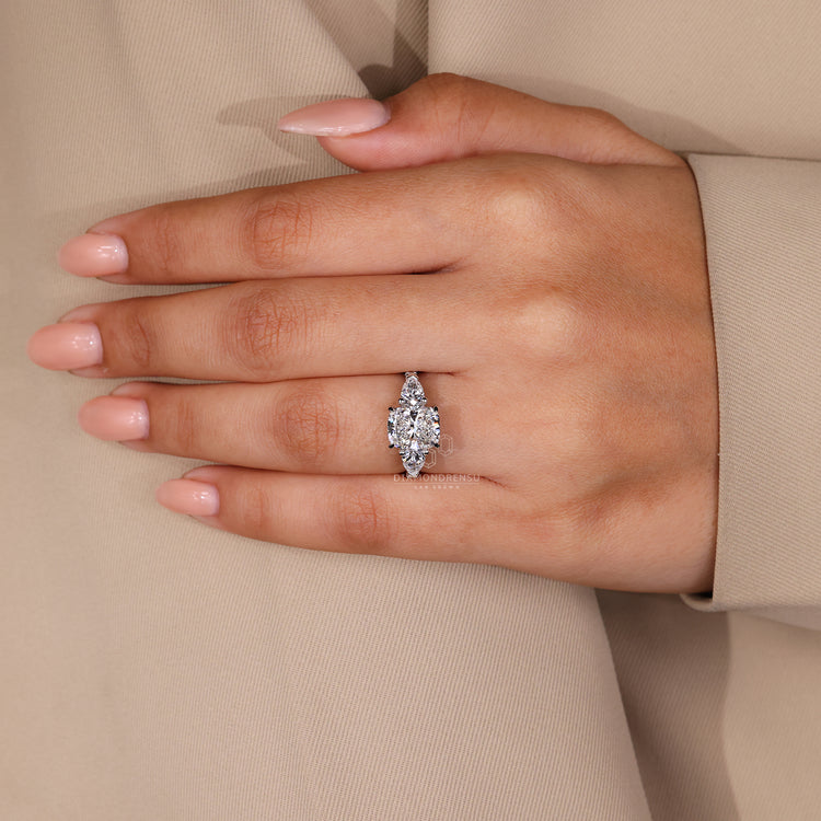 Pear side stone fits hidden halo engagement ring.
