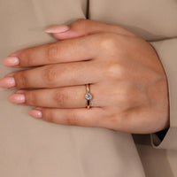 IGI certified round diamond ring in sleek bezel design.
