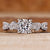 Cushion cut diamond ring marquise and round side stones.