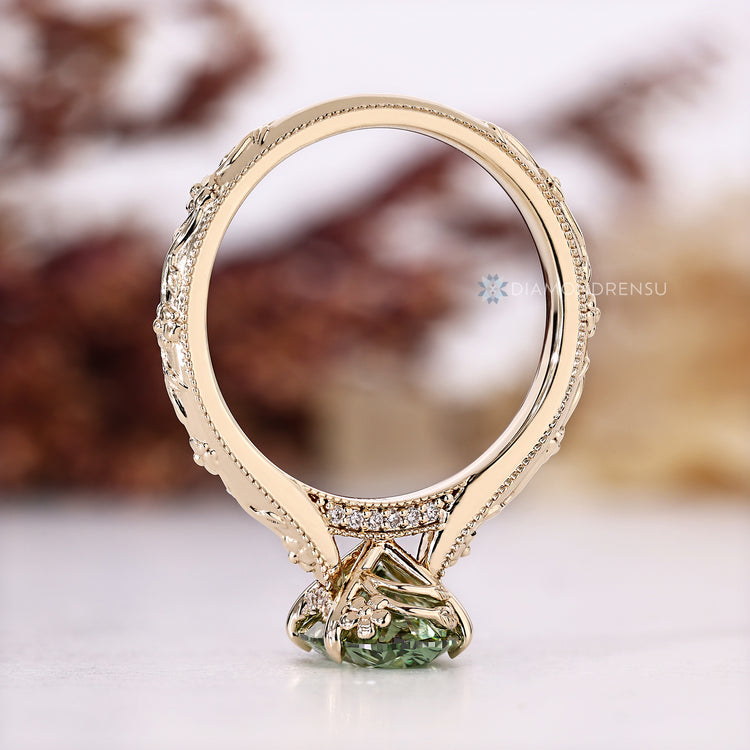 Nature inspired green diamond oval ring.