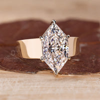 Custom diamond ring with Dutch marquise and tapered shank.