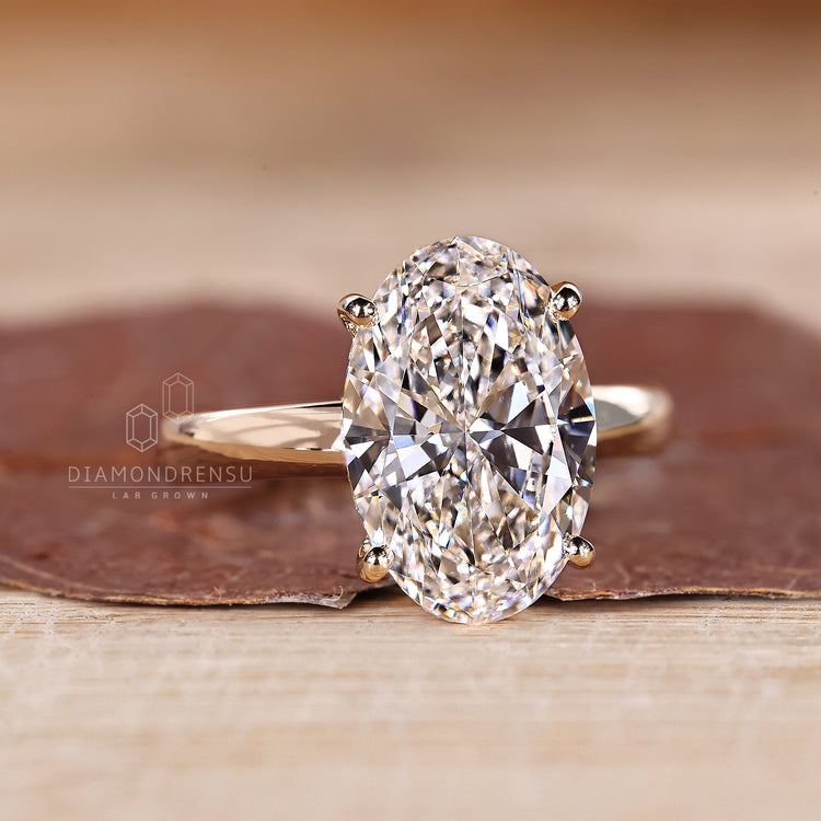 Handmade ring with oval diamond and round hidden halo.